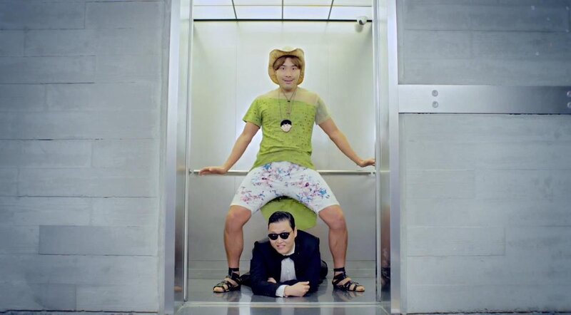 Man in green shirt in elevator