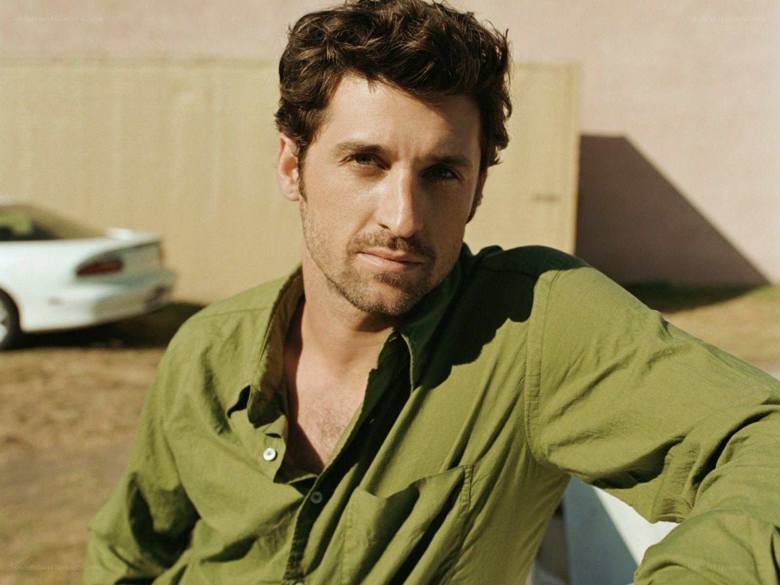 man in green shirt outdoors