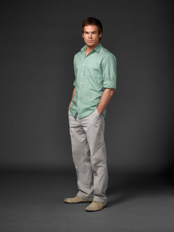 man in green shirt standing