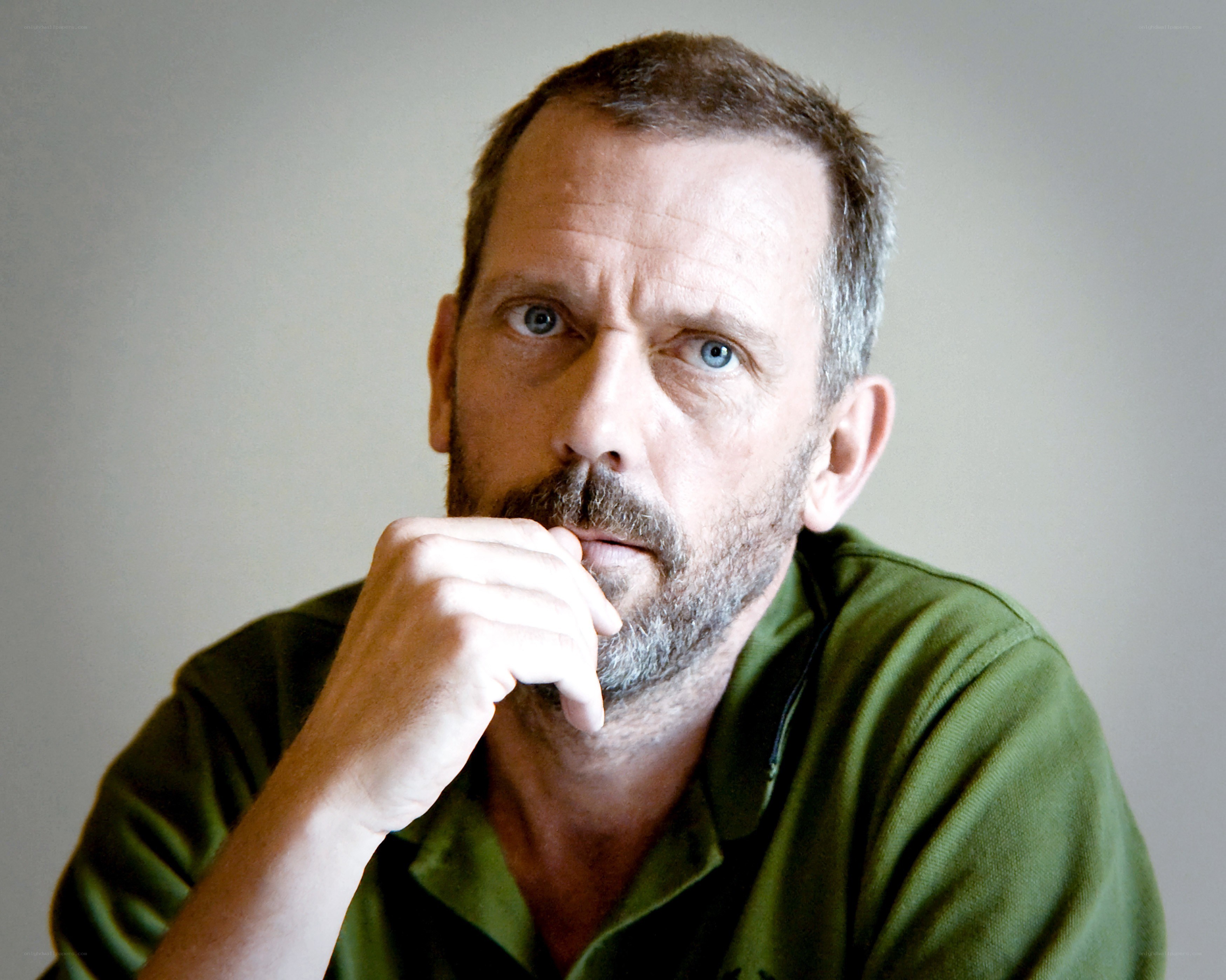 man in green shirt thinking