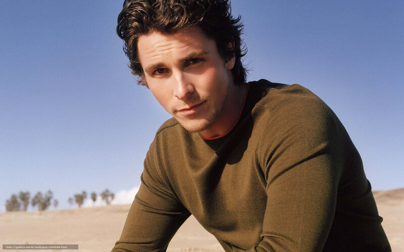 man in green sweater outdoors