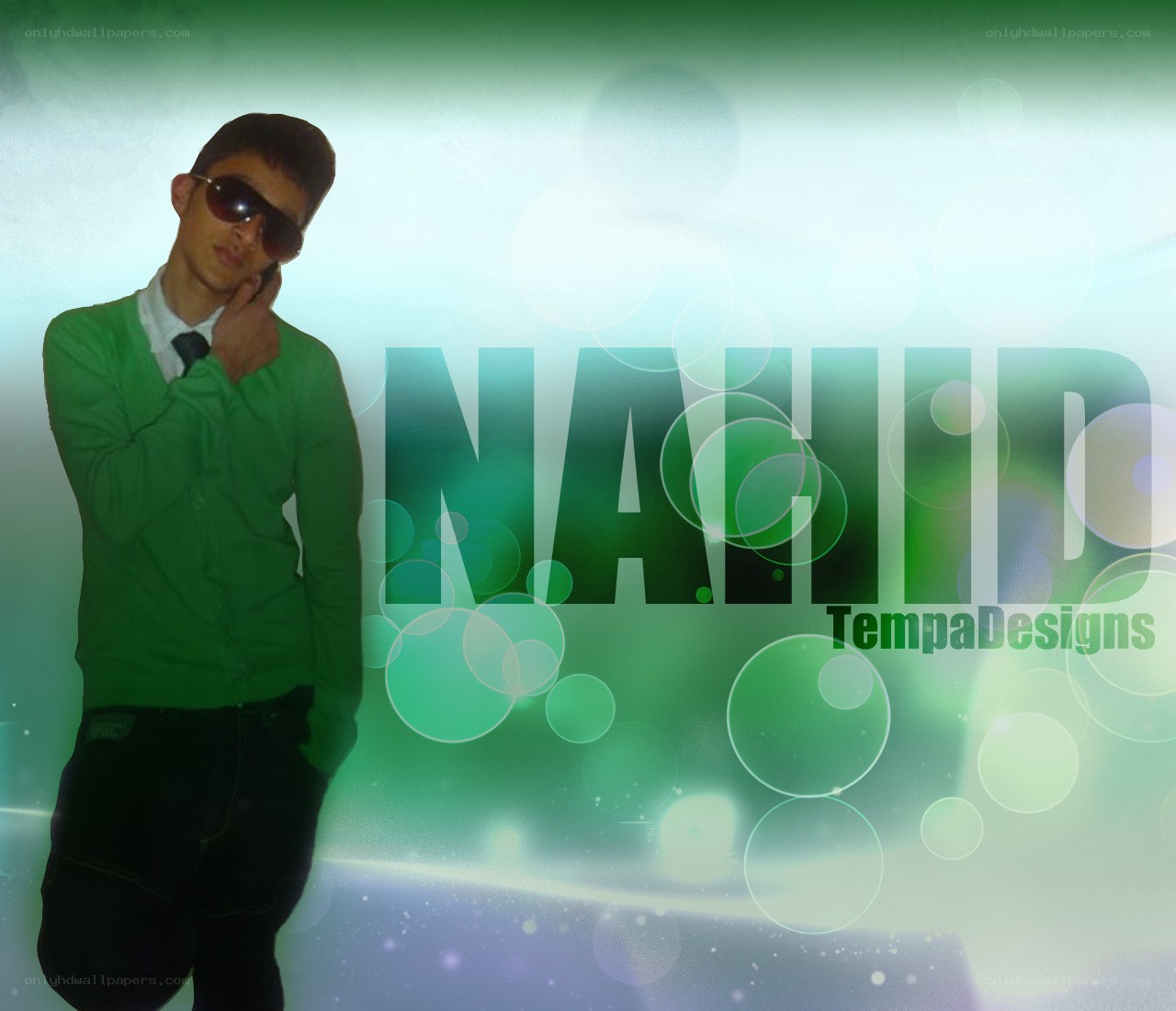 man in green sweater with sunglasses