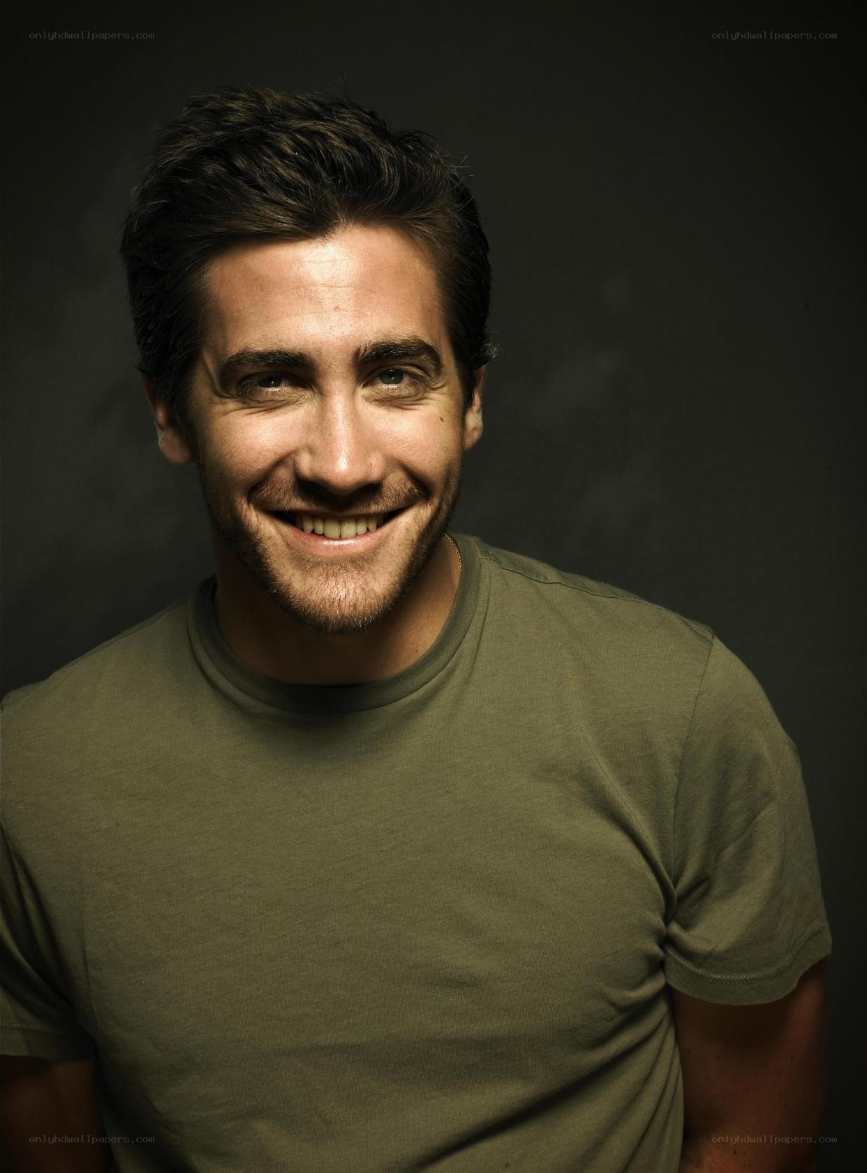 man in green t-shirt smiling