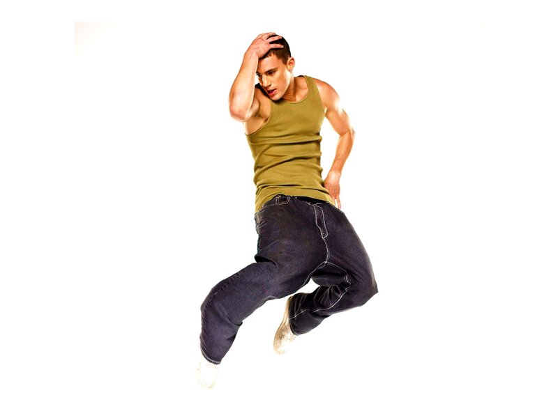 man in green tank top jumping