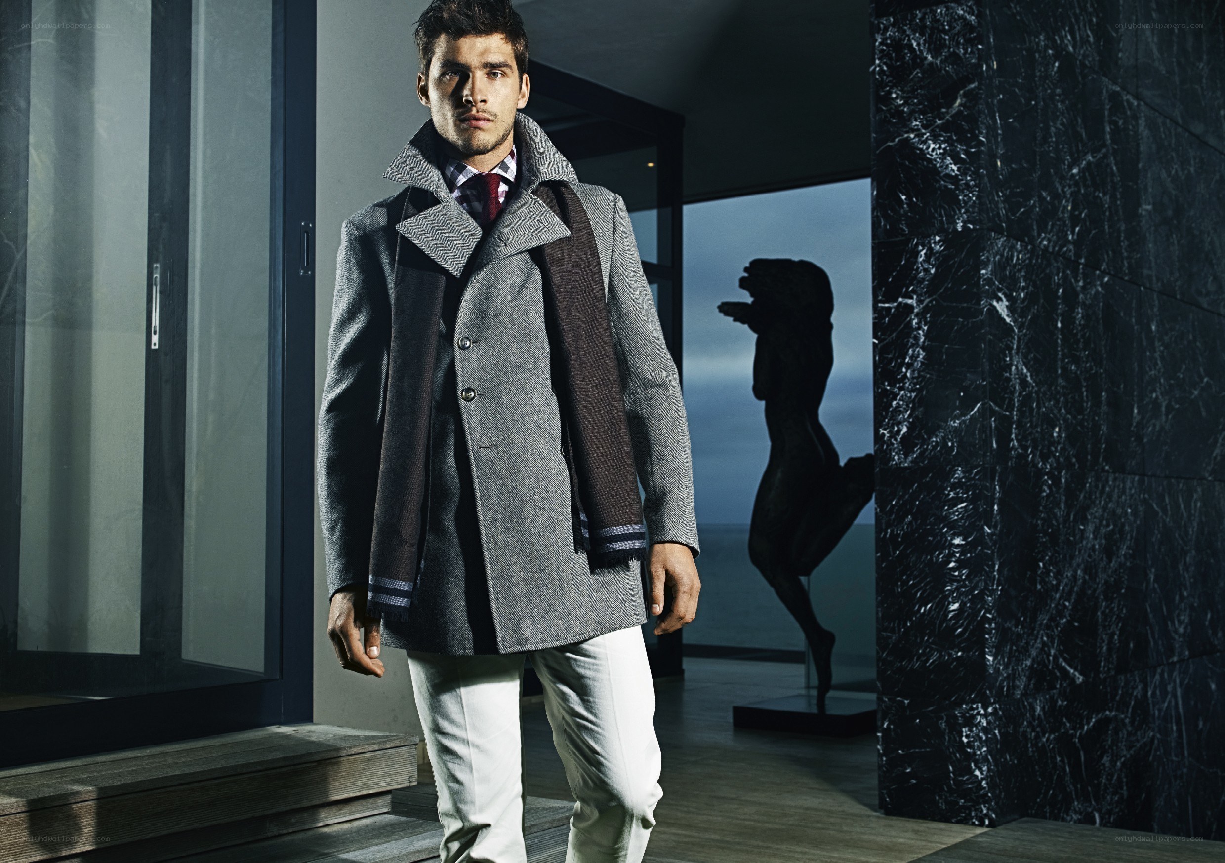man in grey coat standing