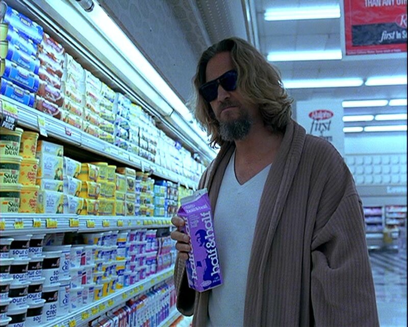 man in grocery store with milk