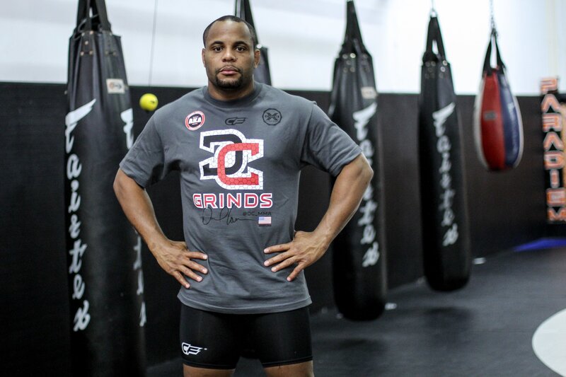man in gym with punching bags