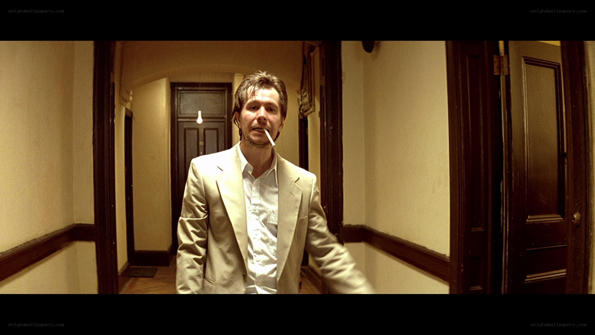 man in hallway with cigarette