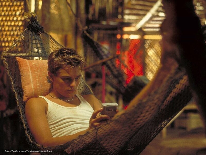 man in hammock with phone