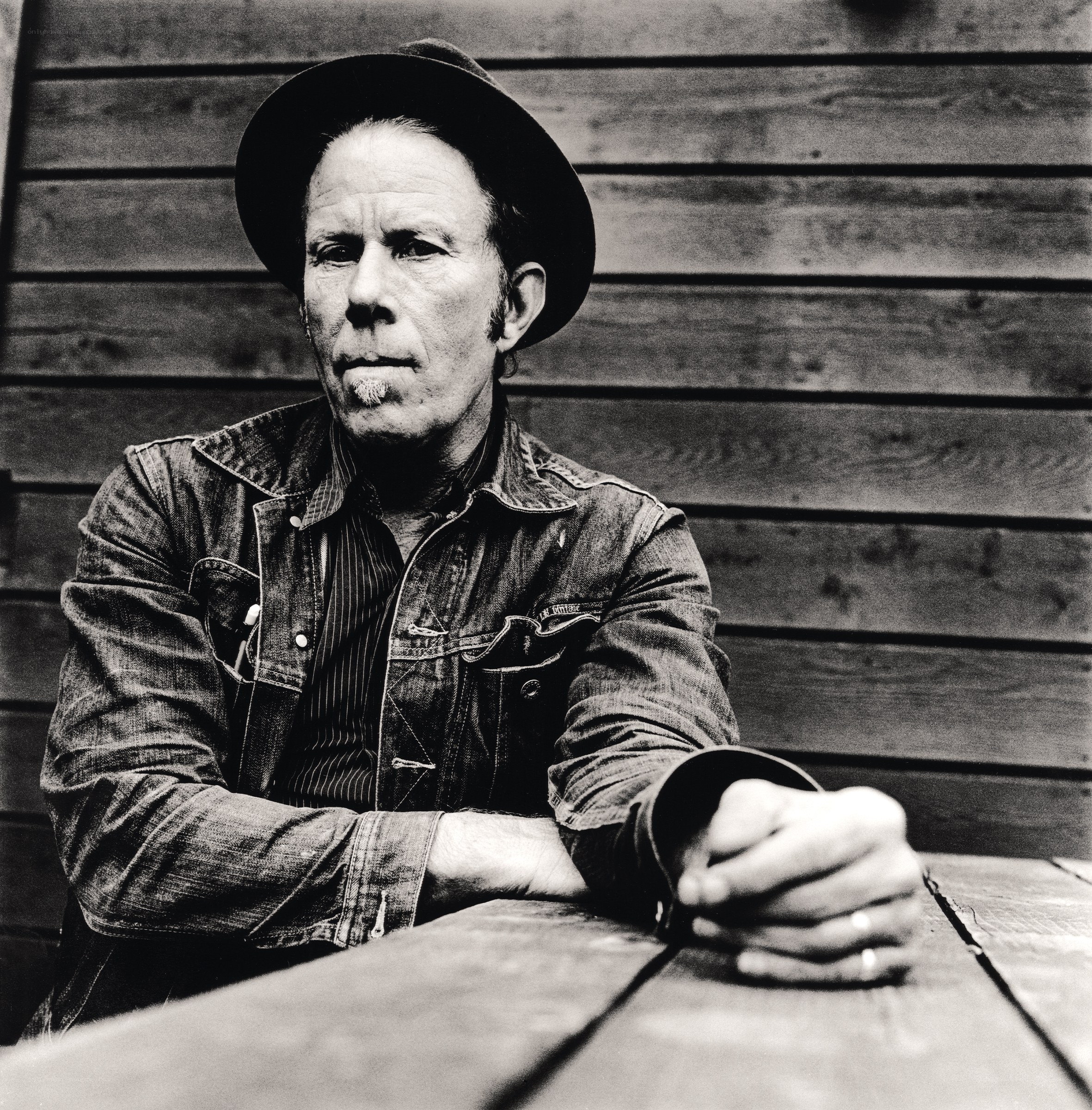 Man in hat and denim jacket