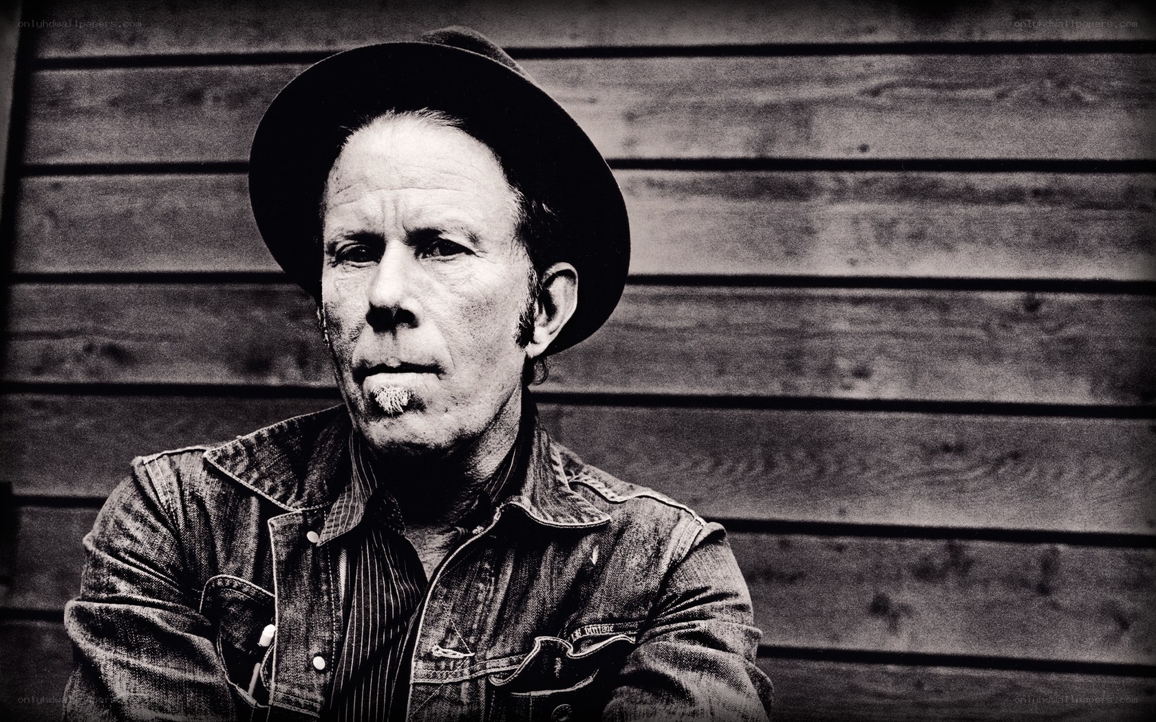 man in hat and denim jacket