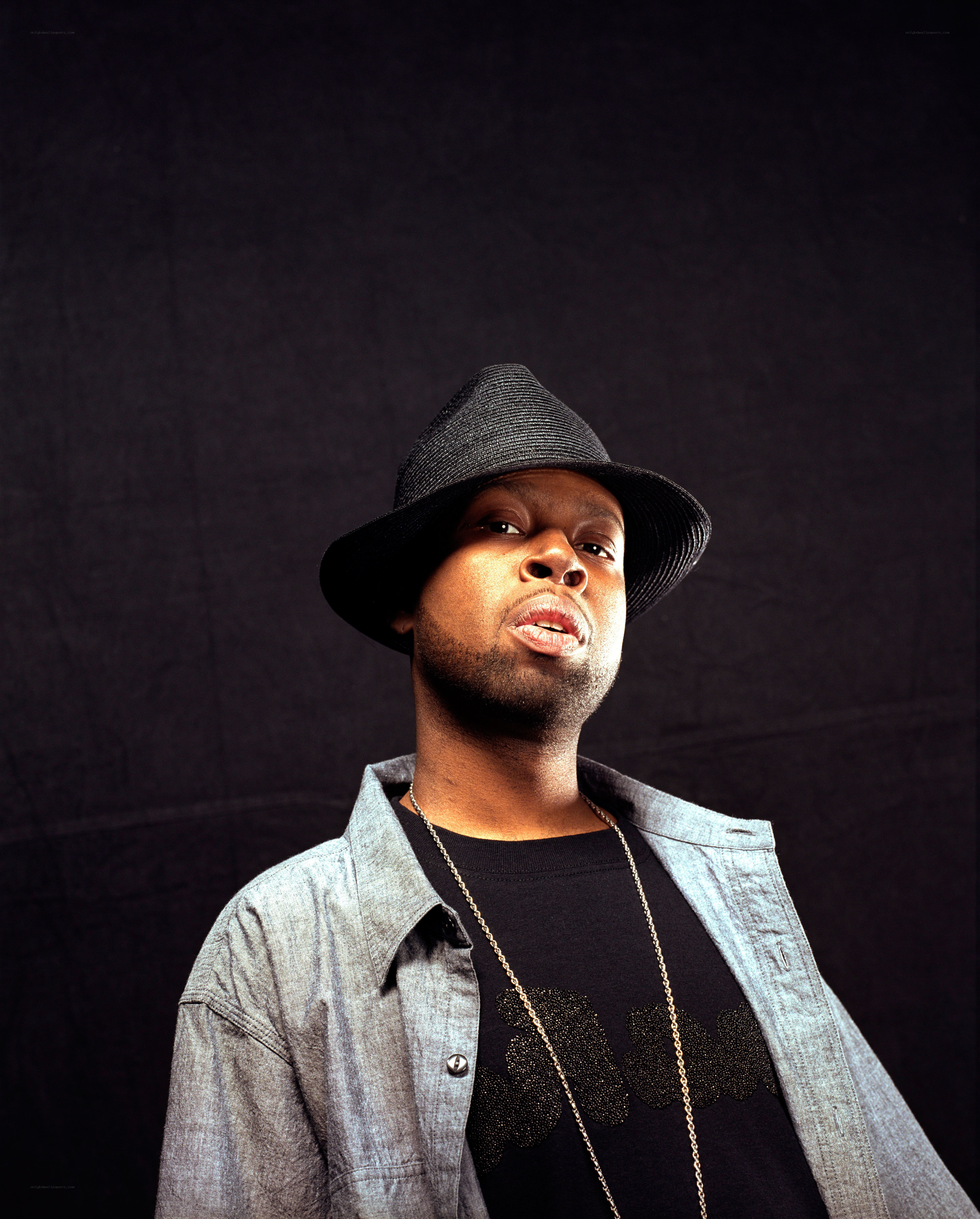 man in hat and denim jacket