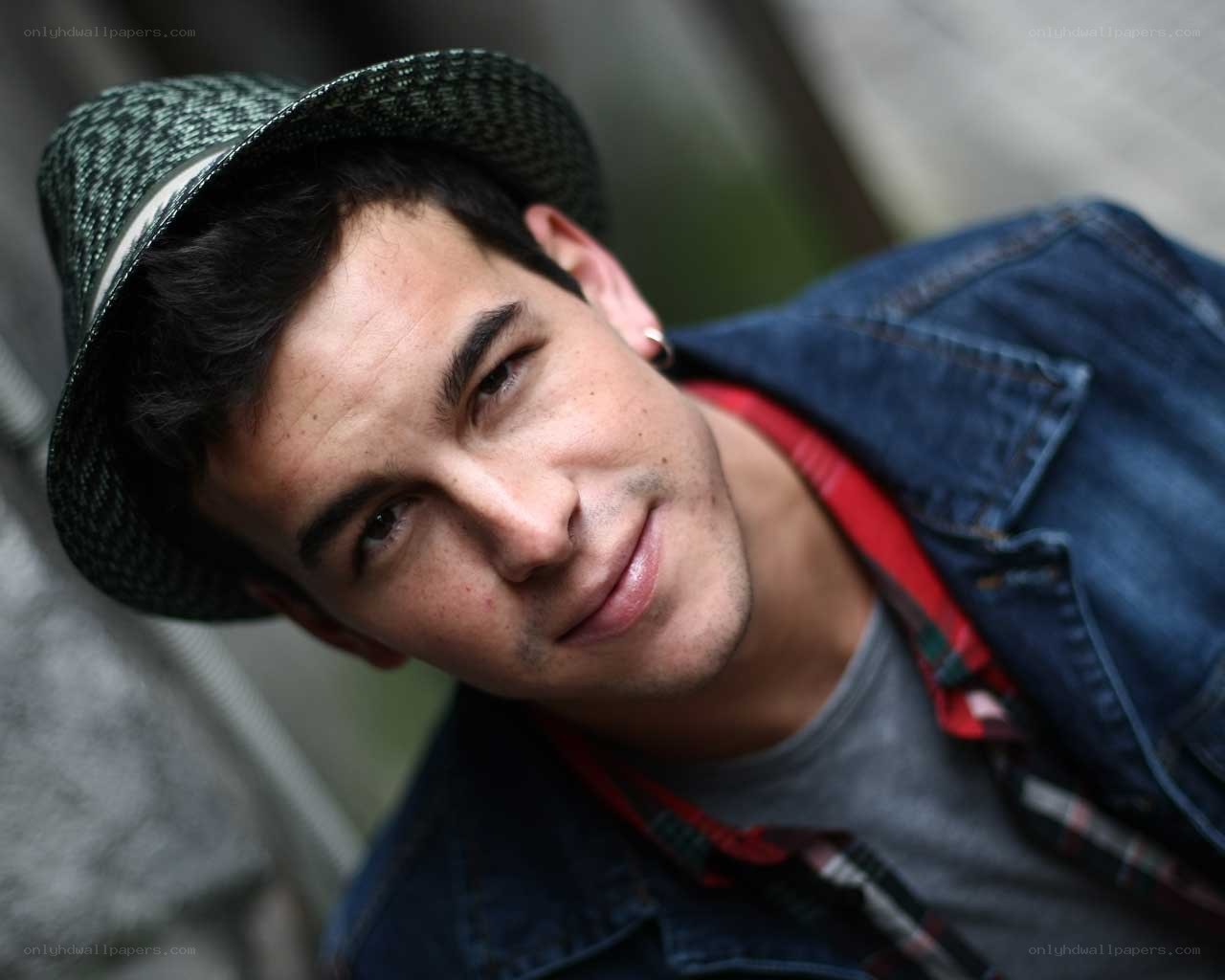 man in hat and denim jacket