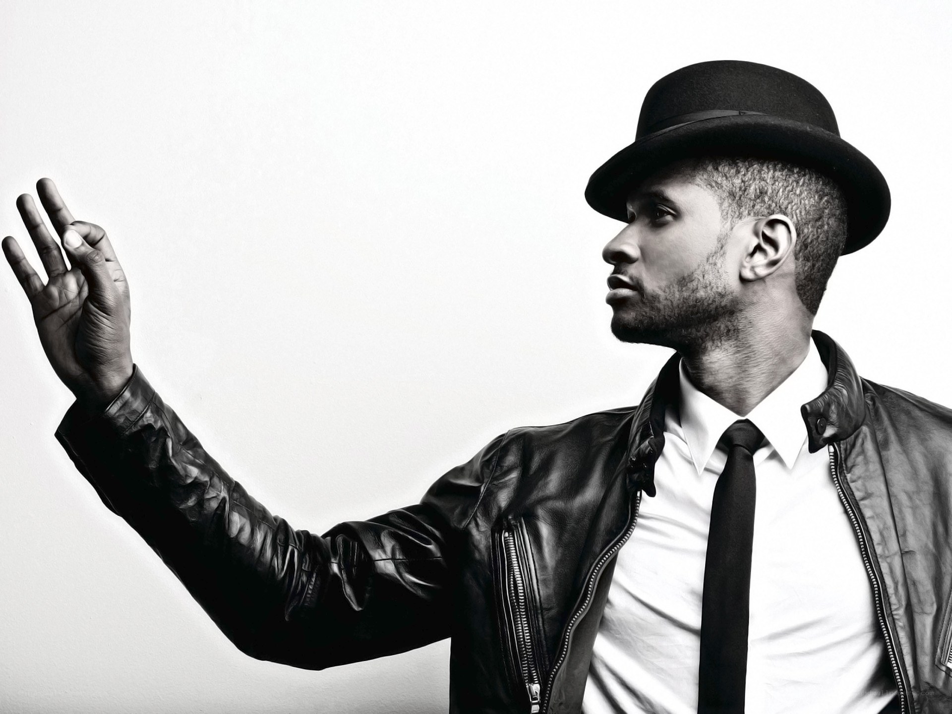 man in hat and leather jacket