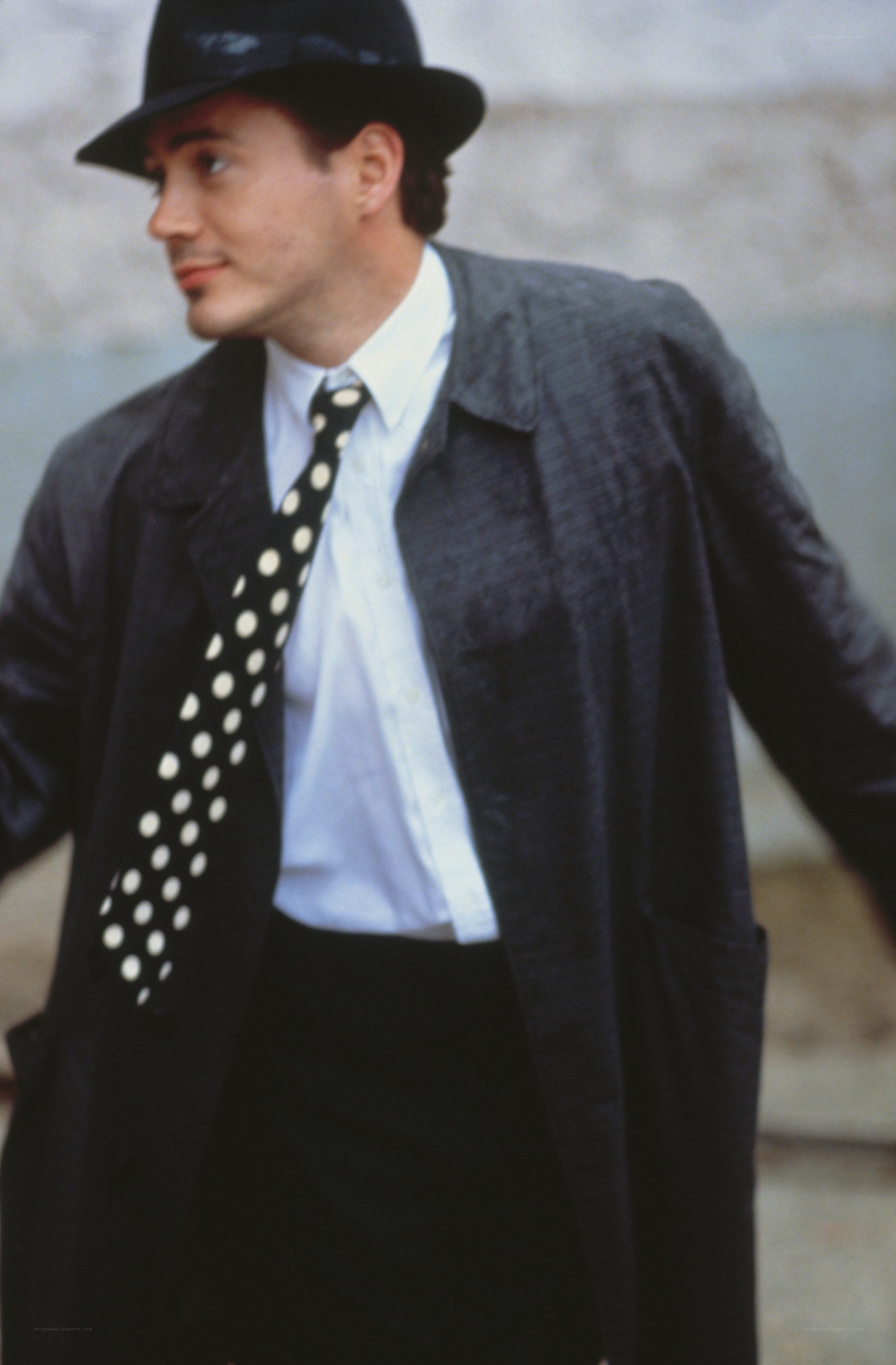 man in hat and polka dot tie