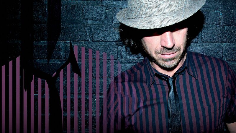 man in hat and striped shirt