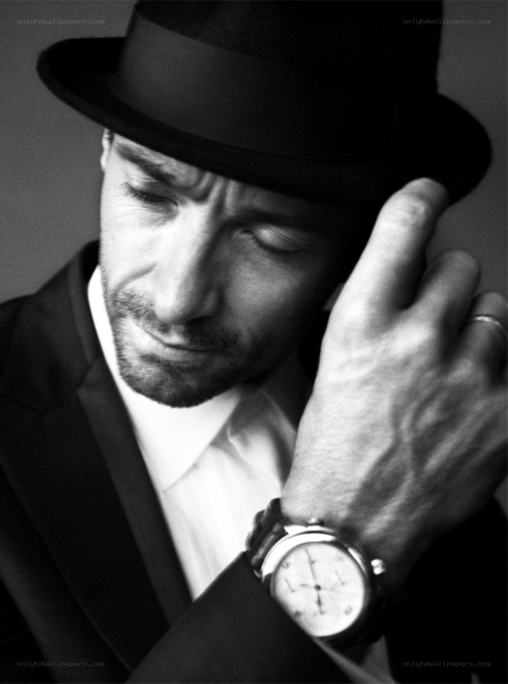 man in hat and suit