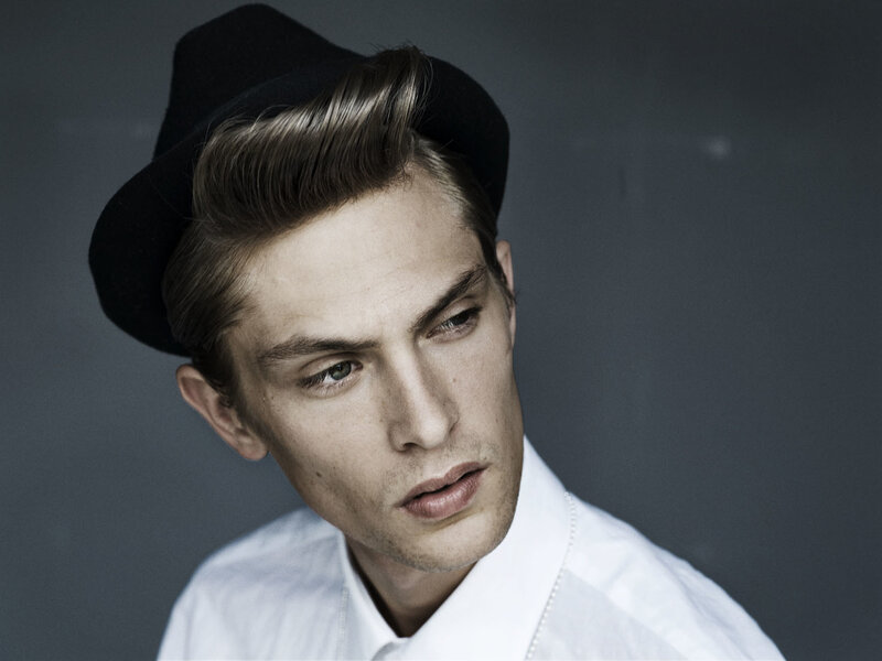 man in hat and white shirt