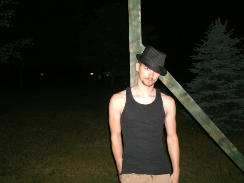 man in hat at night