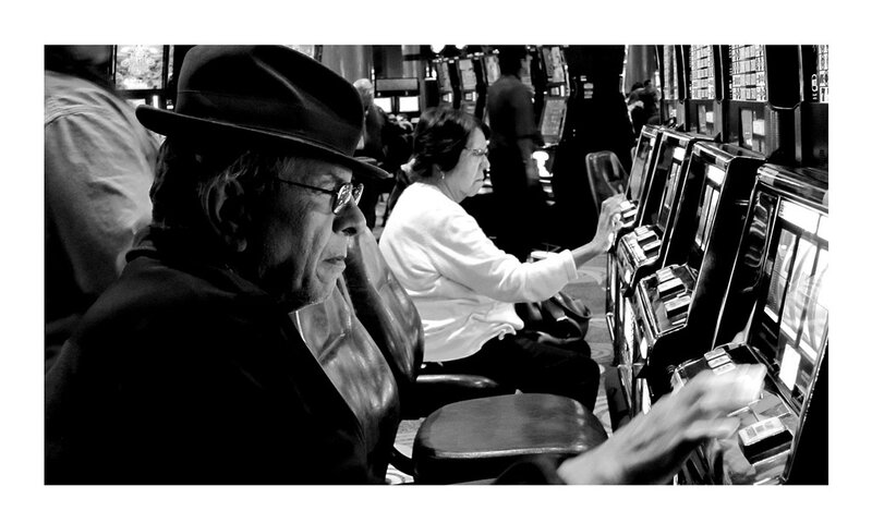 Man in Hat at Slot Machine