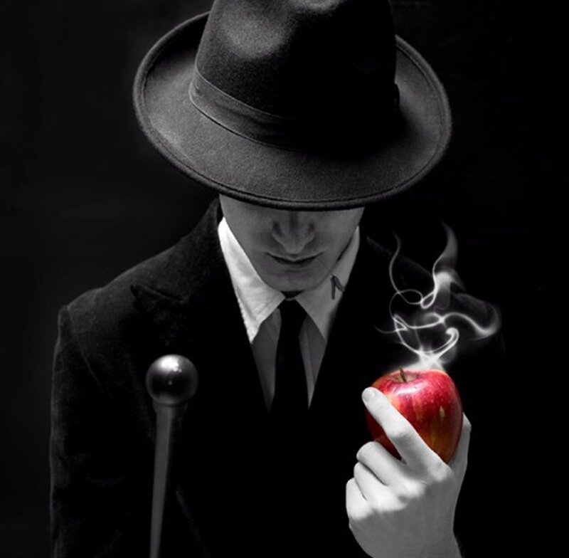 Man in Hat Holding Apple