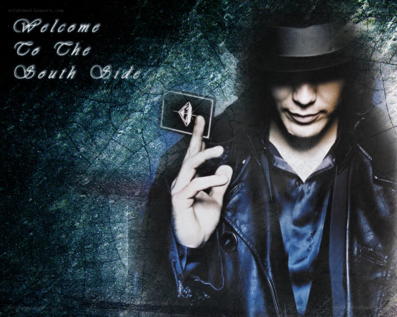man in hat holding card