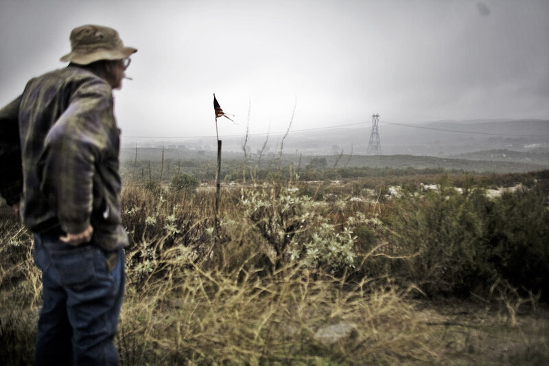 Man in Hat Looking at Landscape