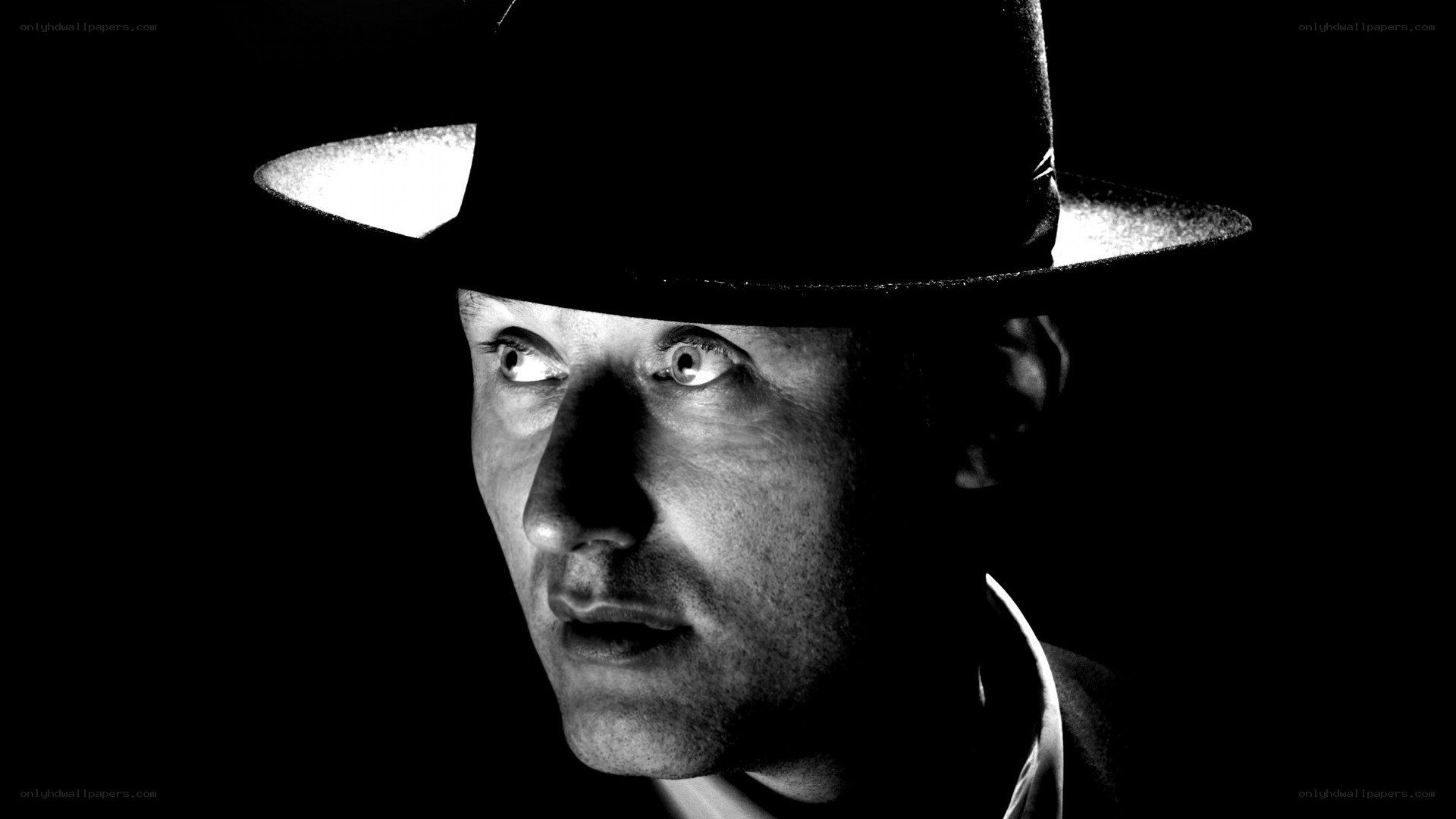 man in hat looking sideways