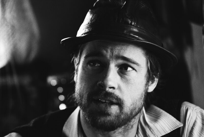 man in hat looking up