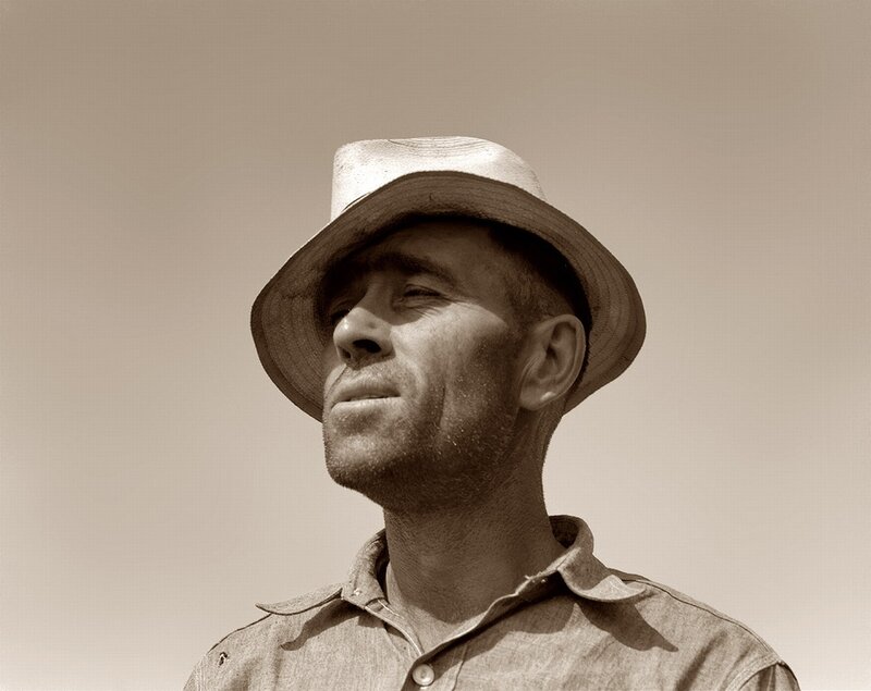 man in hat looking up