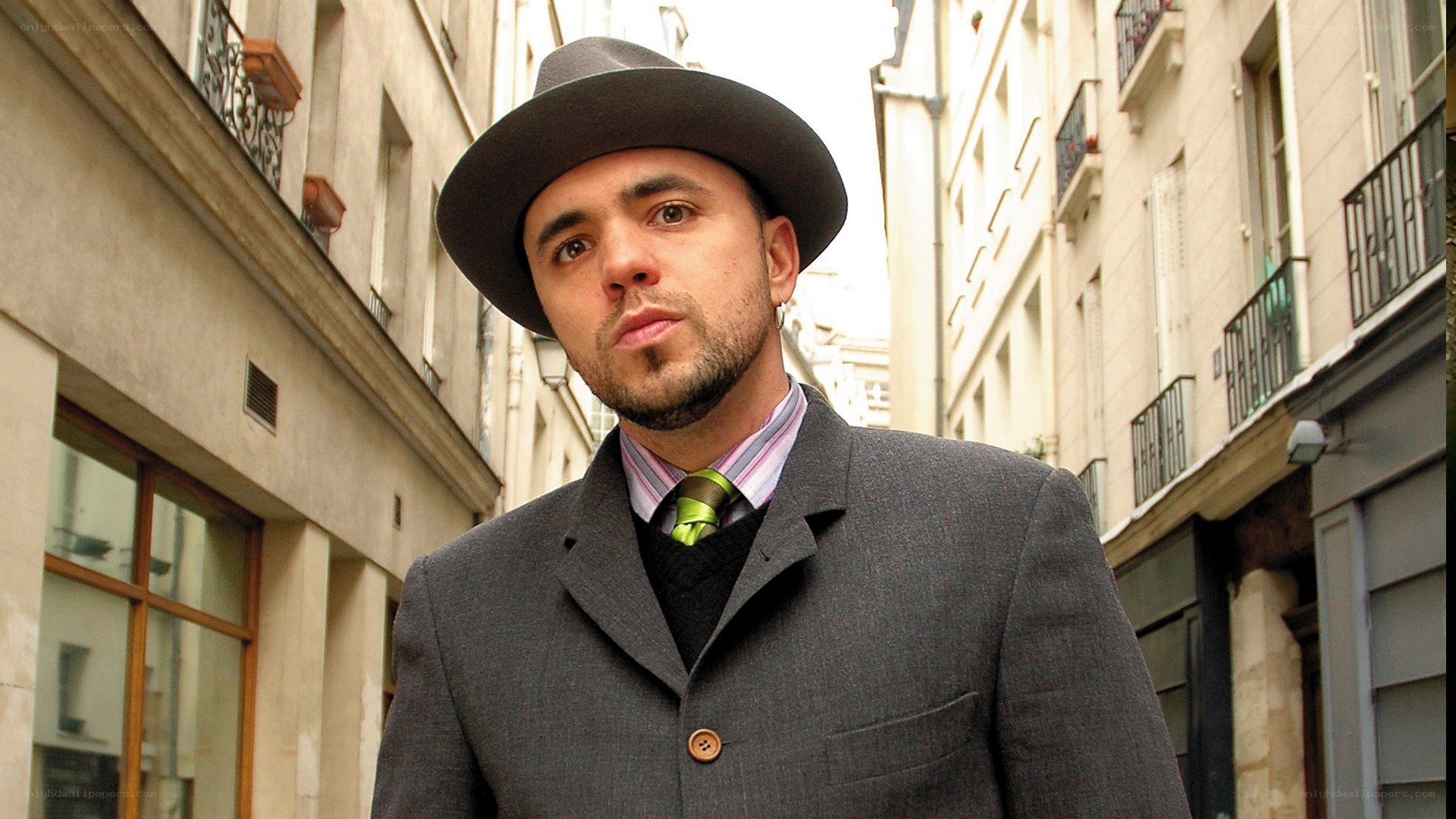 man in hat on city street