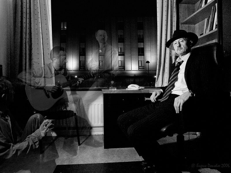 Man in Hat Sitting