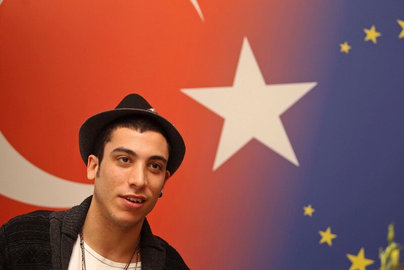man in hat with flags