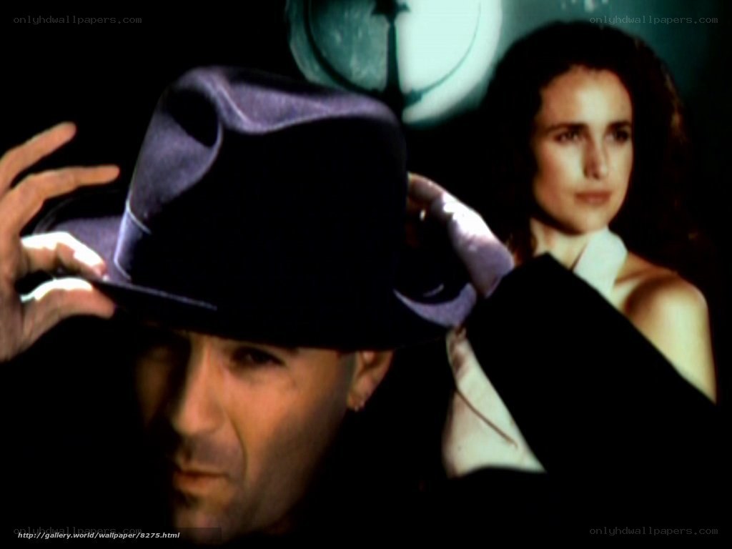 man in hat with woman in background