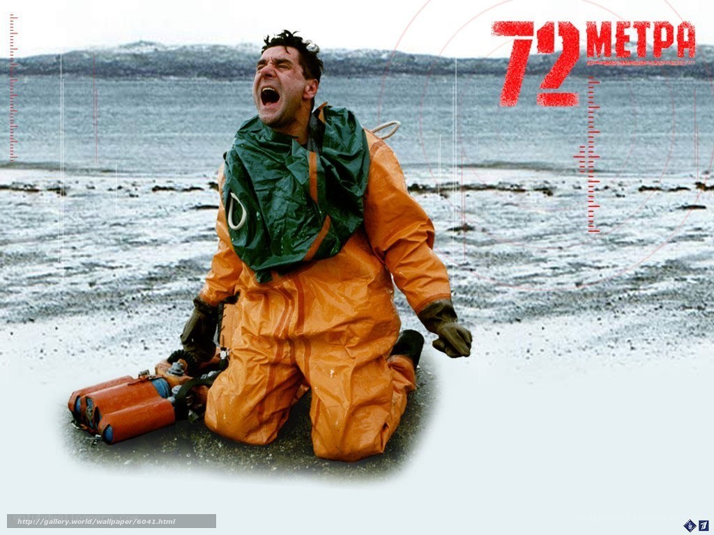 man in hazmat suit on beach