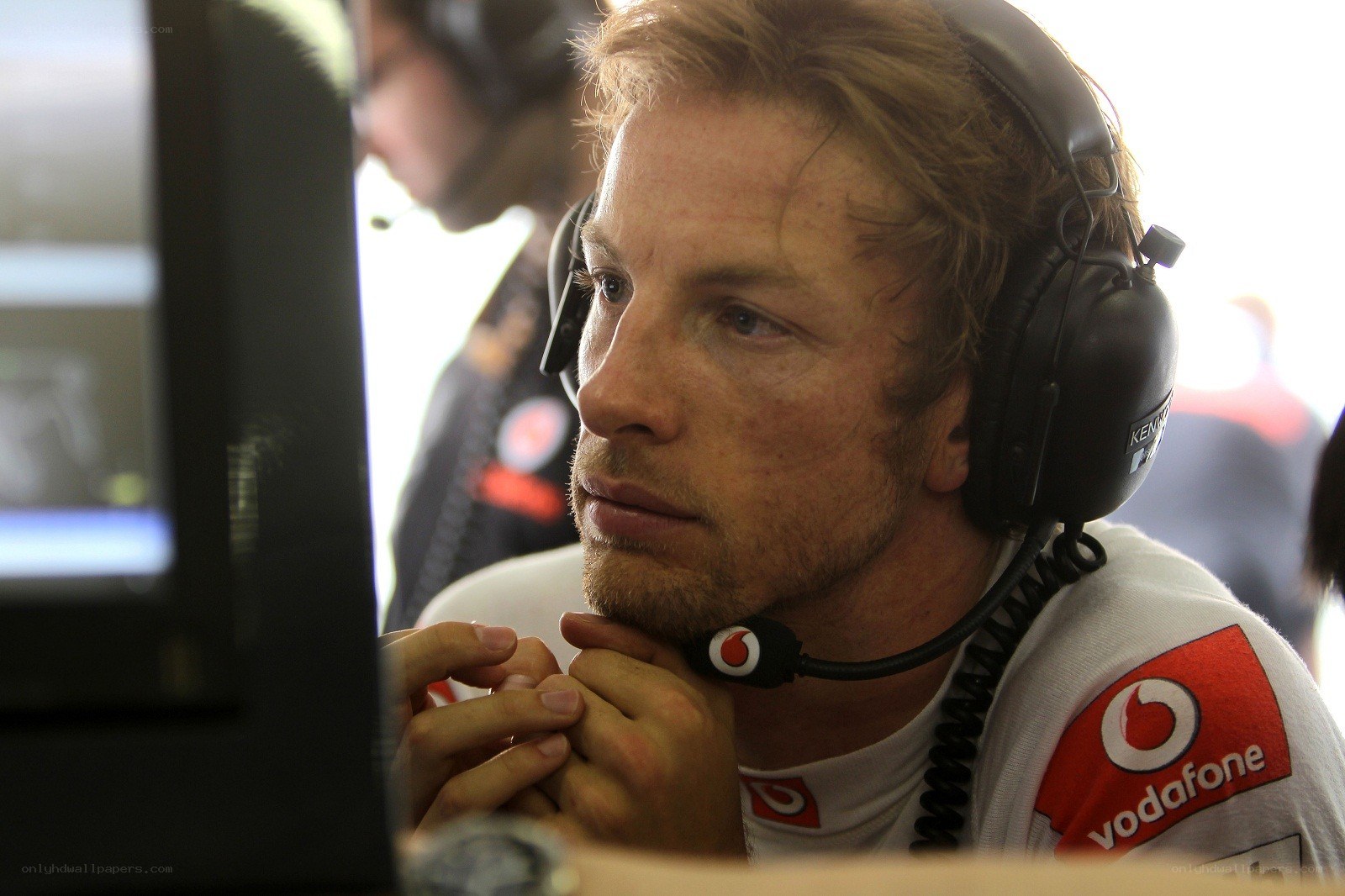 man in headset at computer