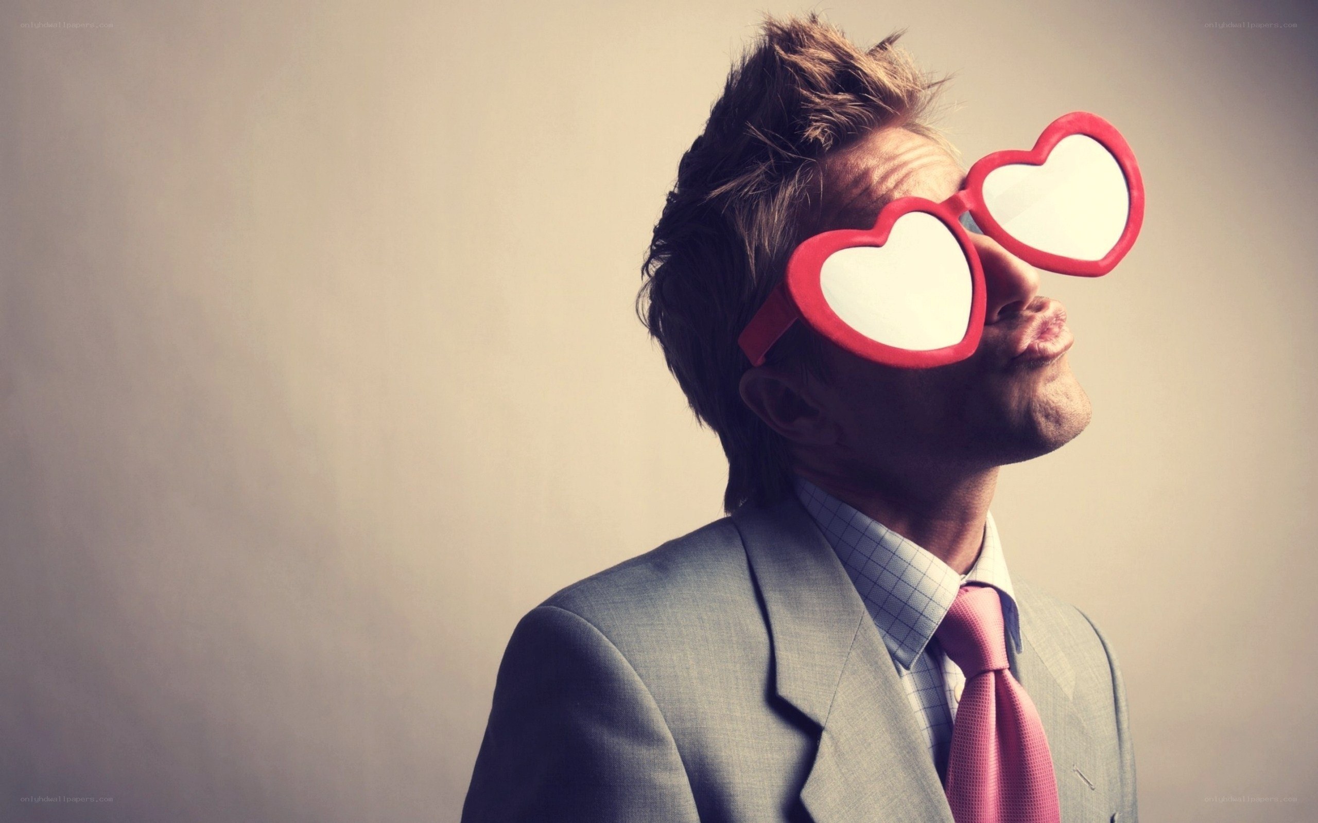 man in heart-shaped glasses