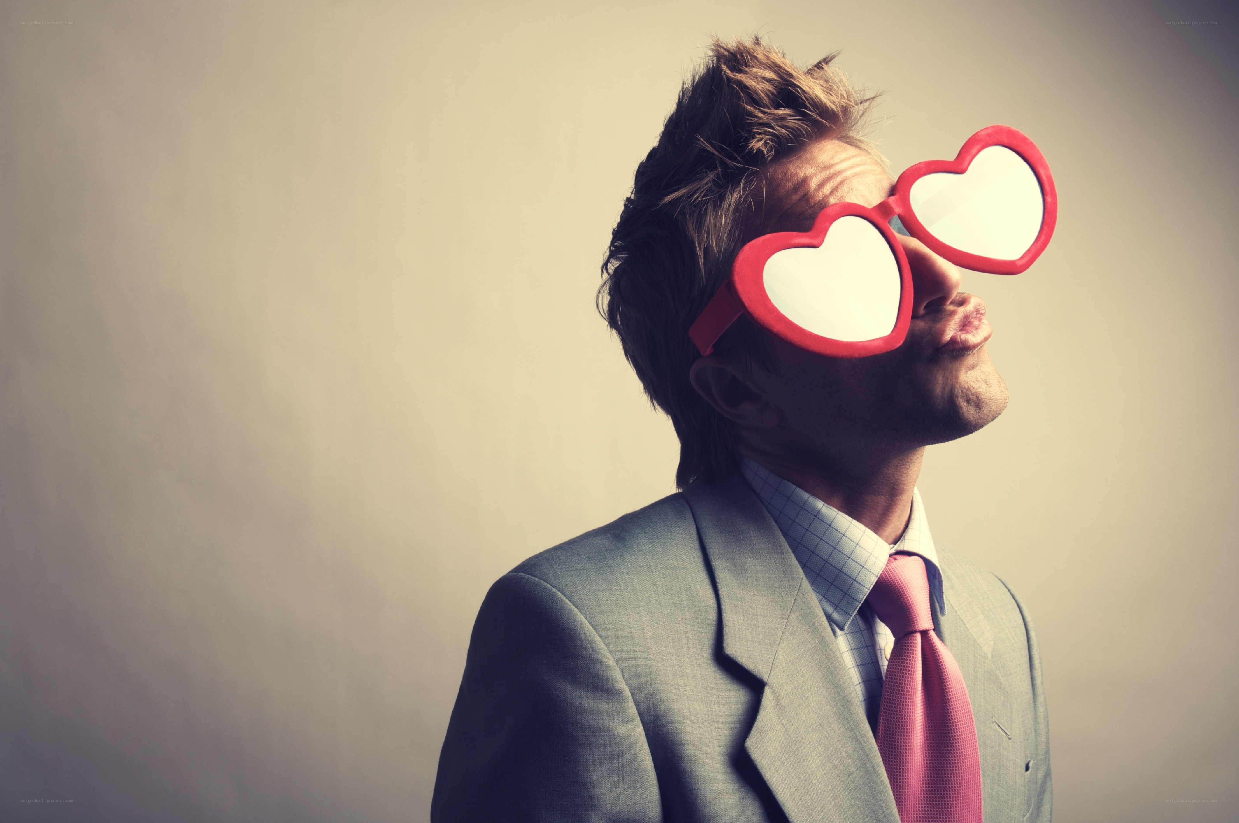 man in heart-shaped glasses