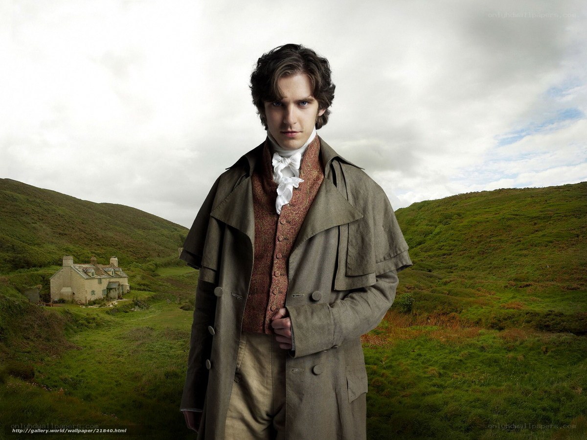 man in historical coat on hillside