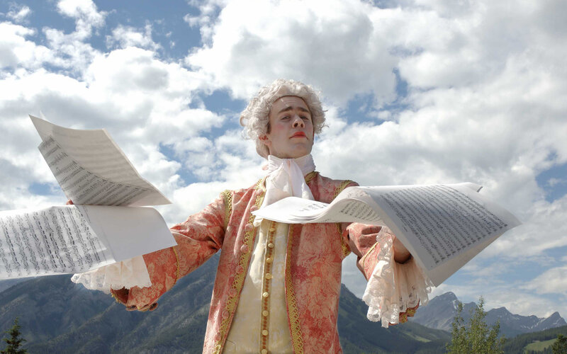 Man in historical costume with sheet music