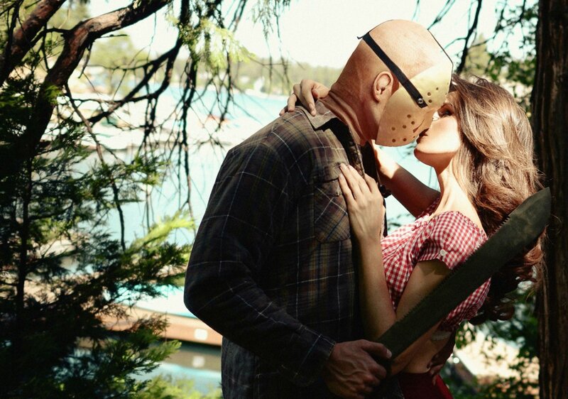 Man in Hockey Mask Kissing Woman