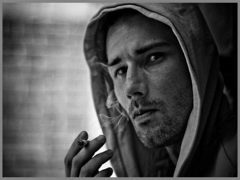 Man in Hood Smoking