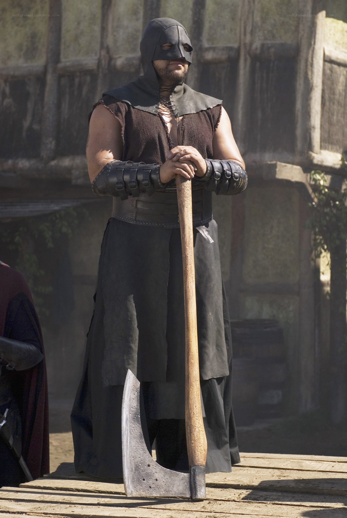man in hooded armor with axe
