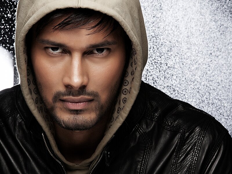 Man in Hooded Jacket — Black, Serious, Photograph