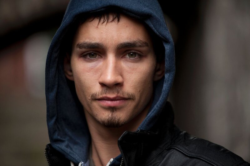 Man in Hooded Jacket — Blue, Serious