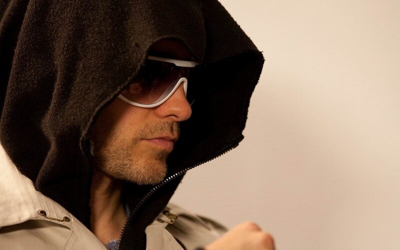 Man in Hooded Jacket — Brown, Serious