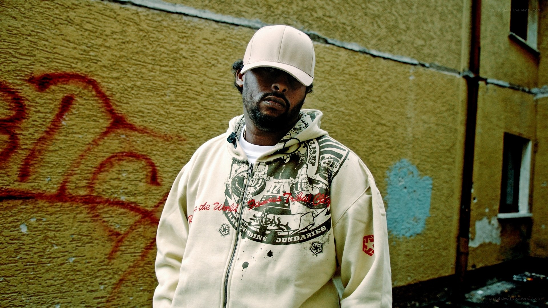 man in hoodie and cap