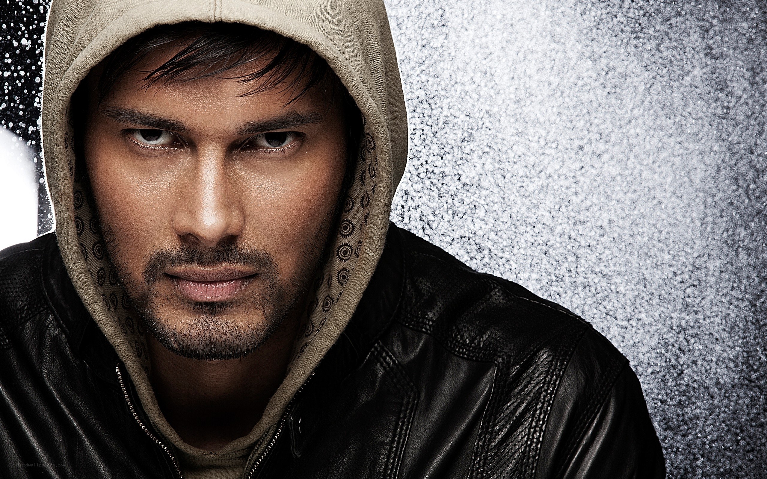 man in hoodie and leather jacket