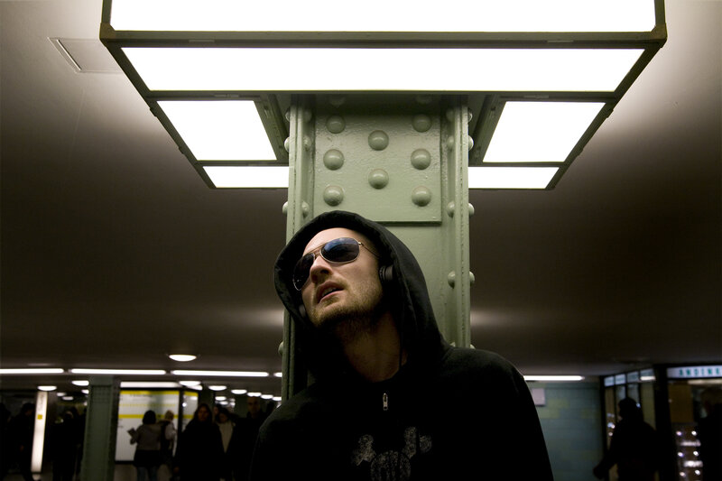 Man in hoodie at subway station