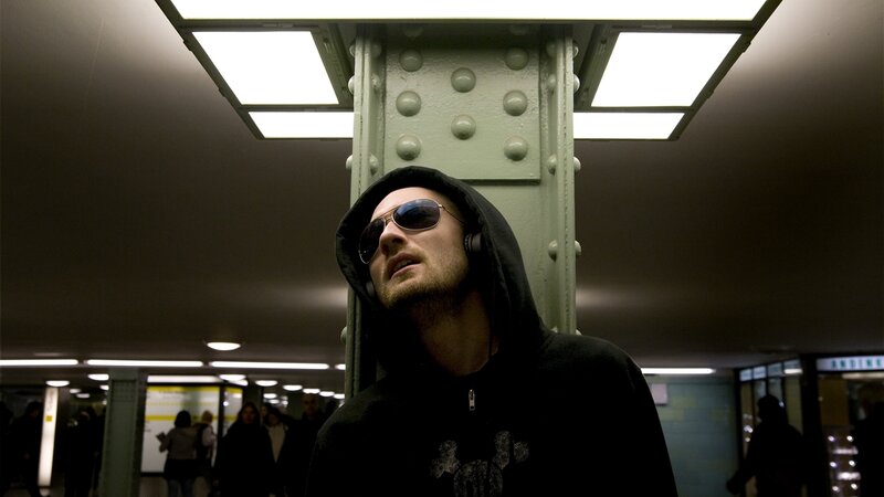 Man in hoodie at subway station